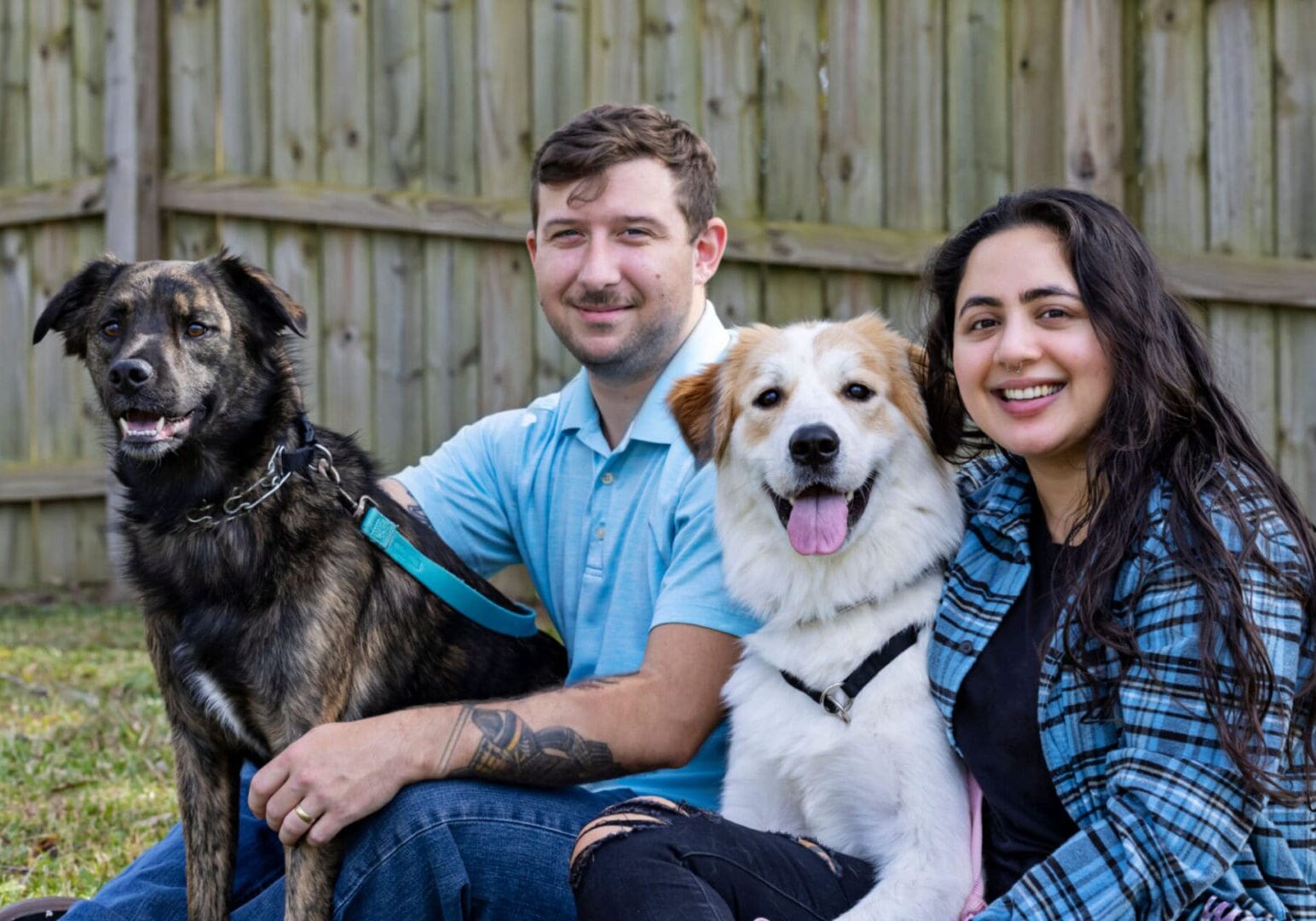 Couple with two dogs outdoors